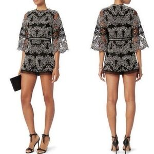 Alexis Veneda lace romper in a black and white
